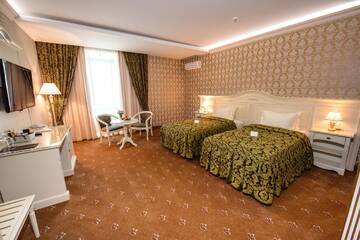 Фото номера Стандартный двухместный номер с 2 отдельными кроватями Отель Savoy г. Кишинёв 2