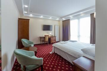Фото номера Большой двухместный номер с 1 кроватью Отель Ambassador Hotel г. Кишинёв 4