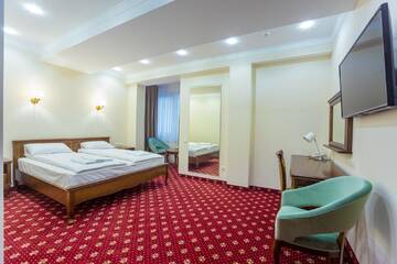 Фото номера Большой двухместный номер с 1 кроватью Отель Ambassador Hotel г. Кишинёв 9